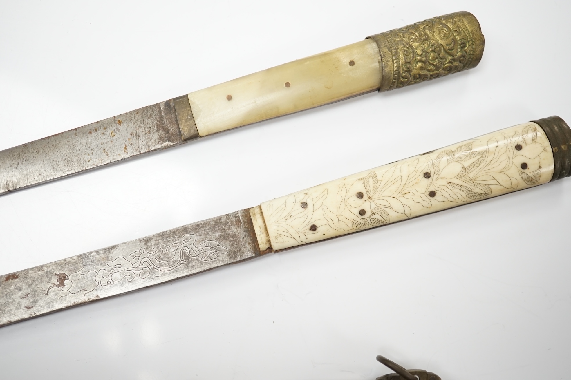 Two Chinese silver chopstick and steel bladed knife sets, one with carved bone handle and tortoiseshell case, largest 34cm in length. Condition - fair to good